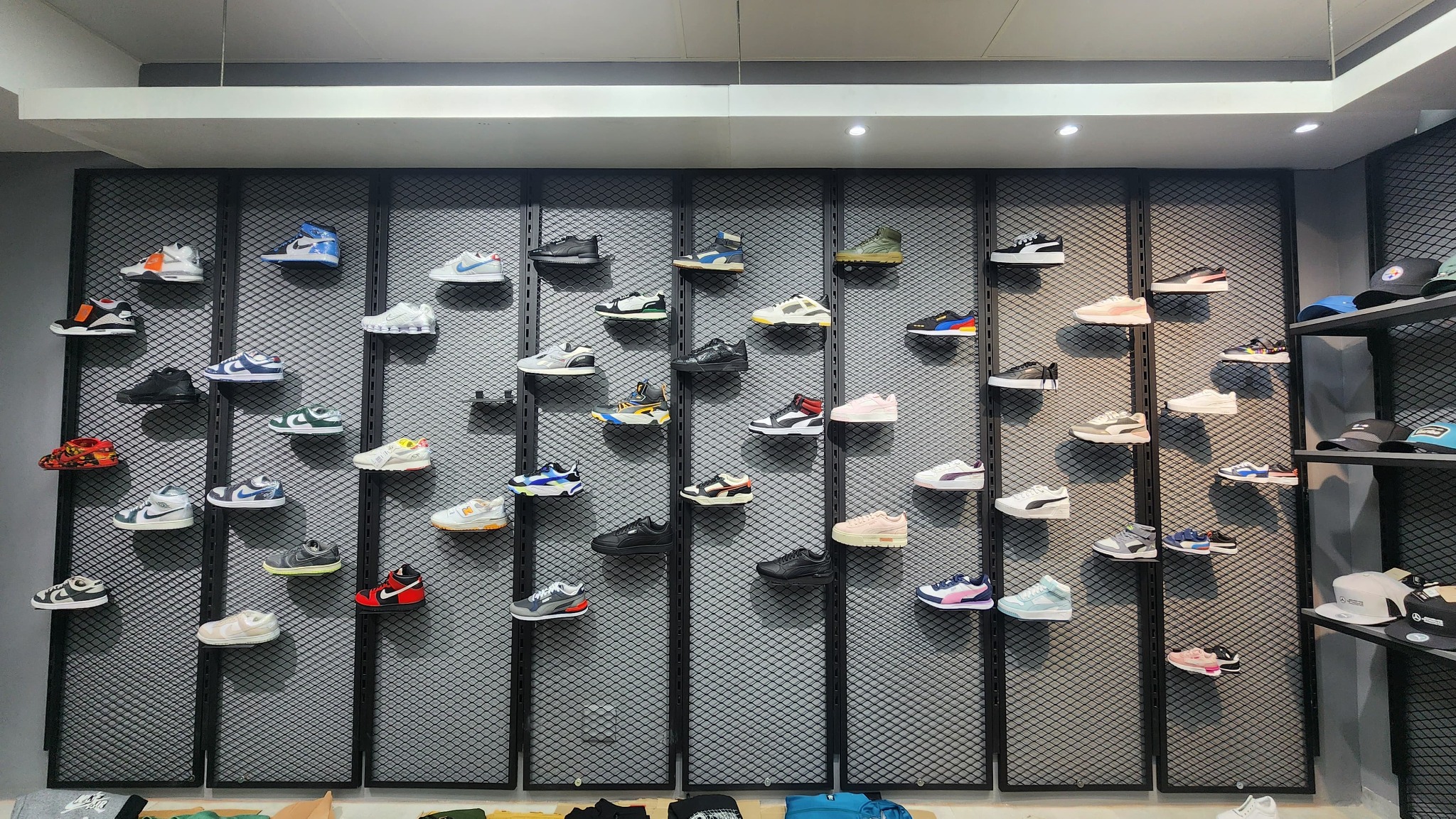 Footwear merchandising display wall